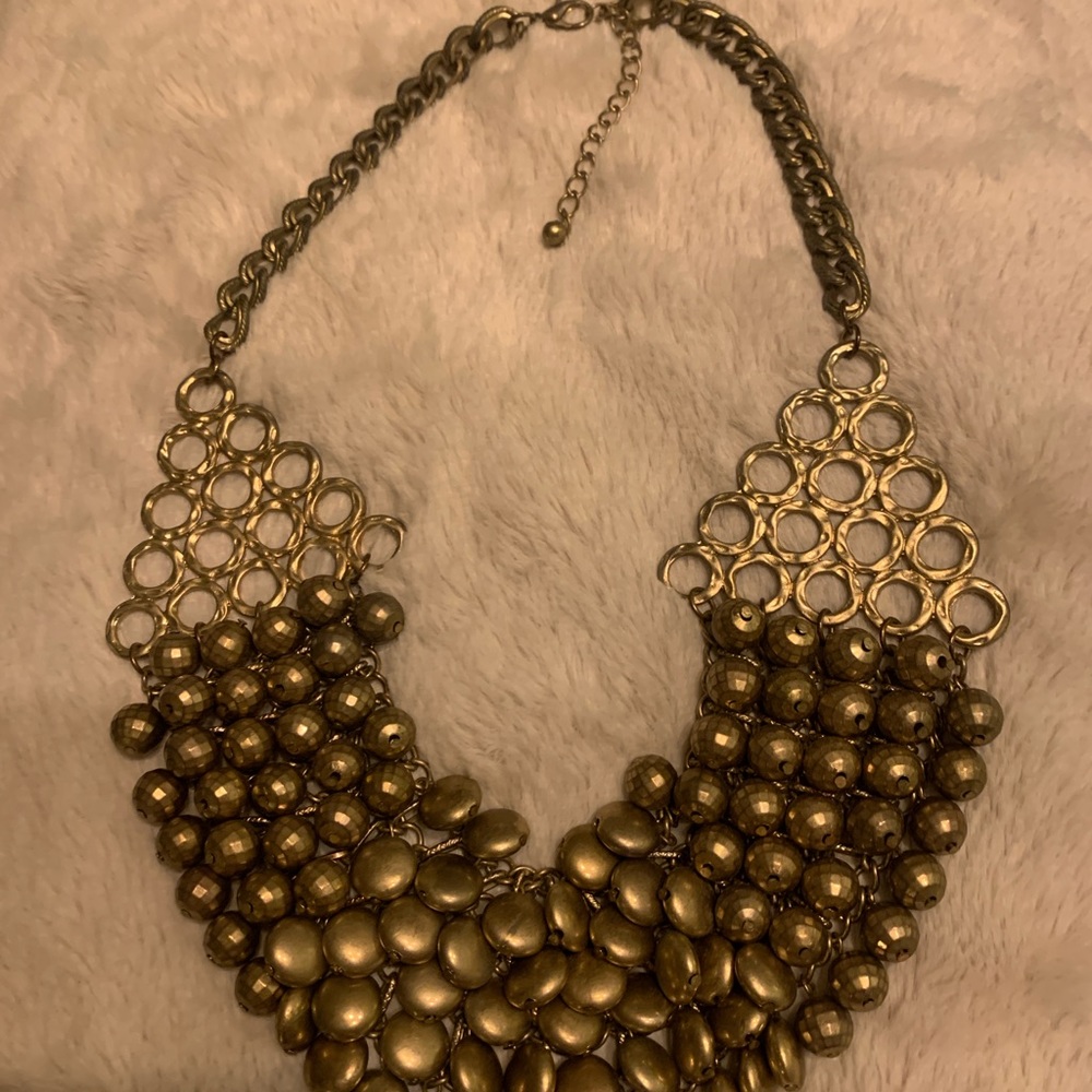Heavy gold statement piece.